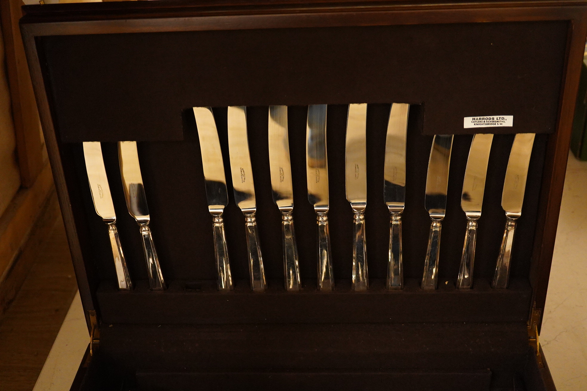 A cased EPNS canteen of cutlery, with a Harrods label. Condition - good